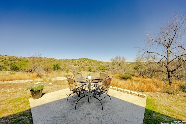 view of patio featuring outdoor dining area