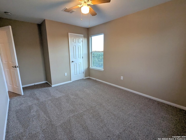 unfurnished bedroom featuring visible vents, baseboards, a ceiling fan, carpet flooring, and a closet