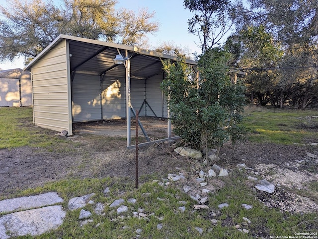 view of outbuilding with a carport