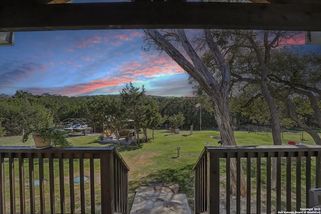 view of yard at dusk