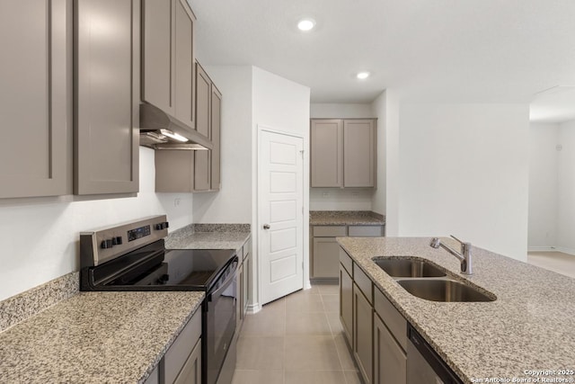 449 Horizon Pl, Seguin, TX 78155 - kitchen featuring stainless steel appliances, under cabinet range hood, a sink, gray cabinets, and light stone countertops