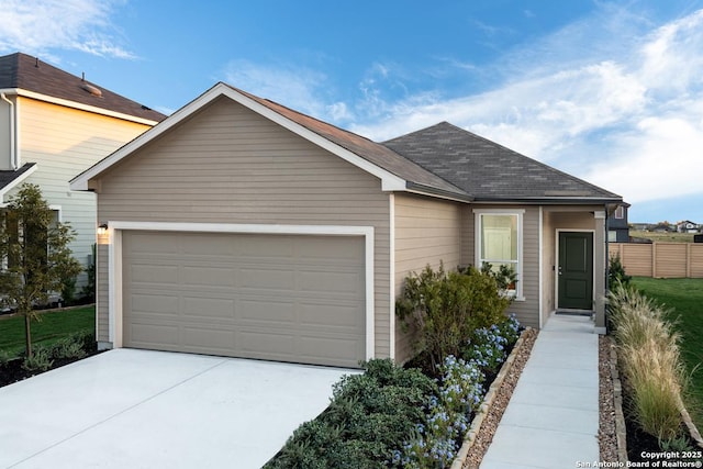 ranch-style home with a garage, driveway, roof with shingles, and fence