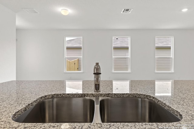 449 Horizon Pl, Seguin, TX 78155 - kitchen view of a sink, light stone countertops, and recessed lighting