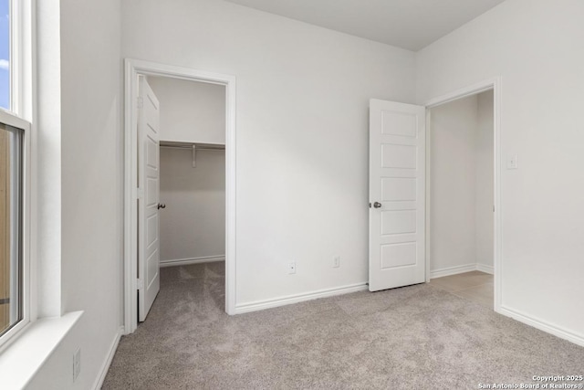 449 Horizon Pl, Seguin, TX 78155 - unfurnished bedroom featuring carpet floors, a spacious closet, baseboards, and a closet