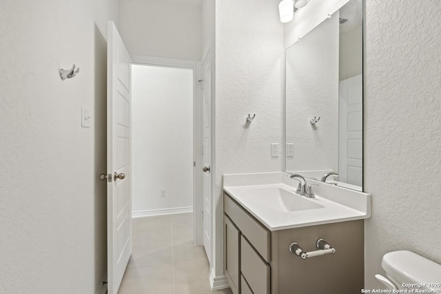 449 Horizon Pl, Seguin, TX 78155 - bathroom with vanity, toilet, tile patterned floors, and a textured wall
