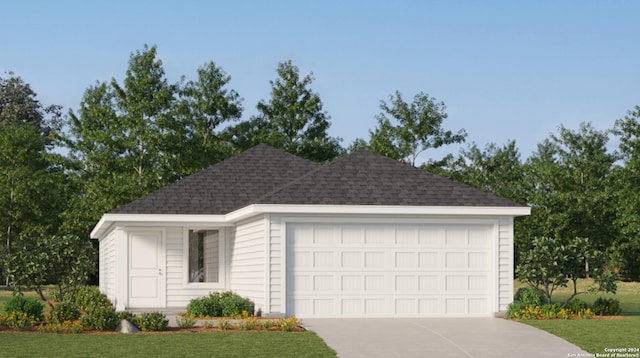 view of front of house with an attached garage, driveway, roof with shingles, and a front yard