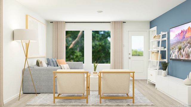 interior space featuring light wood-style floors and baseboards