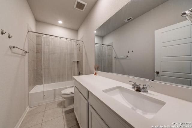 bathroom featuring toilet, vanity, visible vents, and tile patterned floors