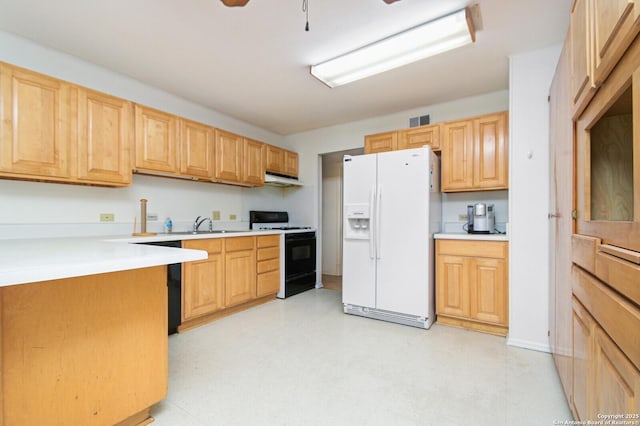 kitchen featuring light floors, white fridge with ice dispenser, under cabinet range hood, and range with gas cooktop