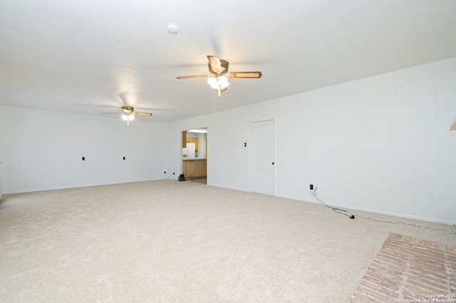 unfurnished room featuring ceiling fan and light colored carpet