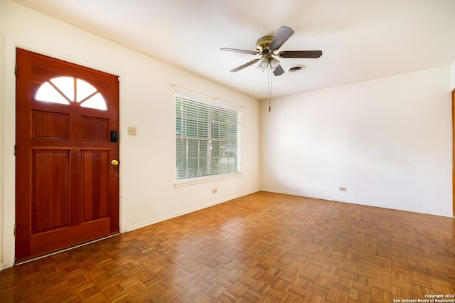 foyer featuring a ceiling fan and visible vents