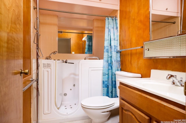 bathroom with curtained shower, vanity, and toilet