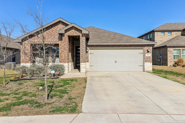 view of front facade with a garage, concrete driveway, stone siding, central air condition unit, and brick siding