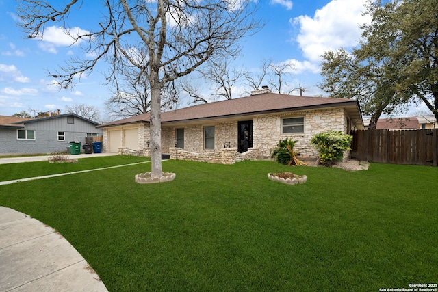 ranch-style home with stone siding, a chimney, an attached garage, fence, and a front lawn