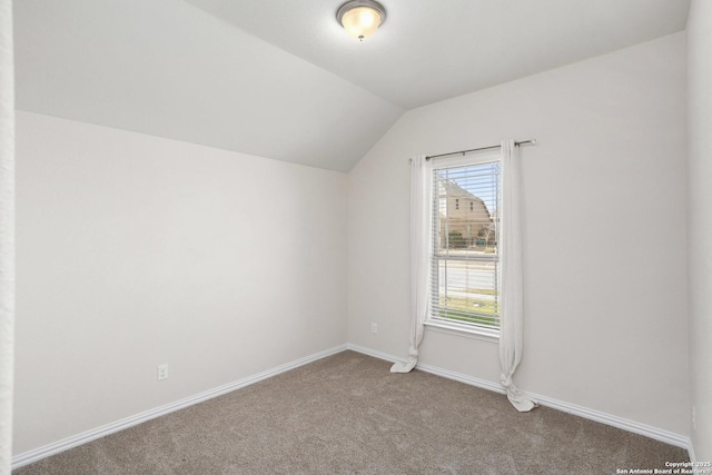 bonus room with carpet floors, lofted ceiling, and baseboards