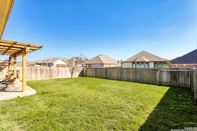 view of yard with a fenced backyard and a pergola