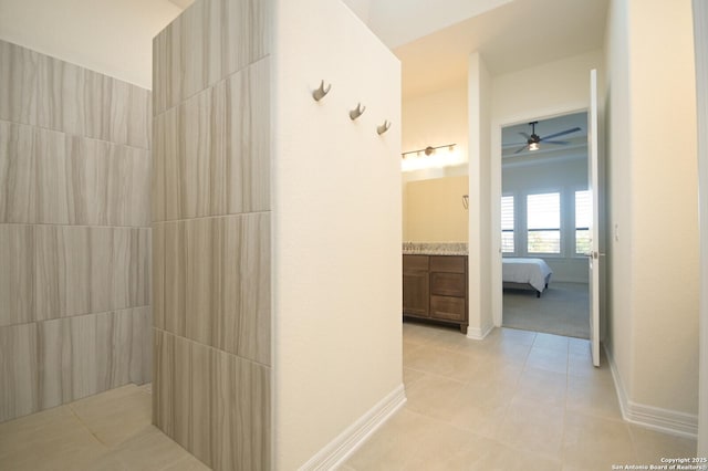 full bathroom featuring baseboards, vanity, and tile patterned floors