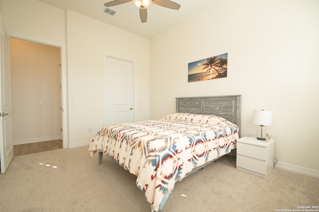 carpeted bedroom featuring visible vents, ceiling fan, and baseboards