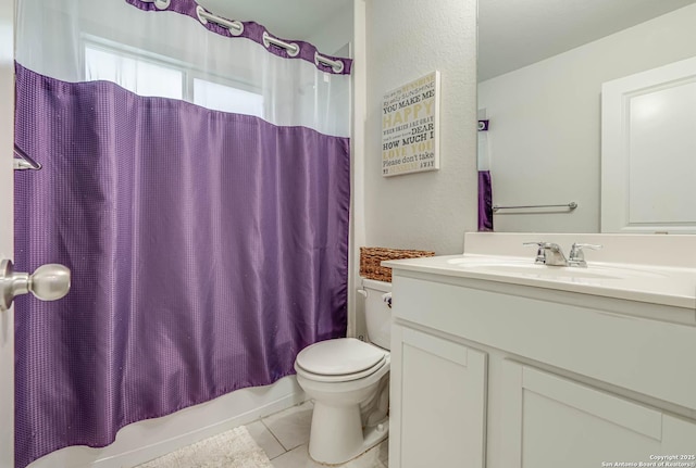 bathroom with tile patterned flooring, shower / tub combo with curtain, vanity, and toilet