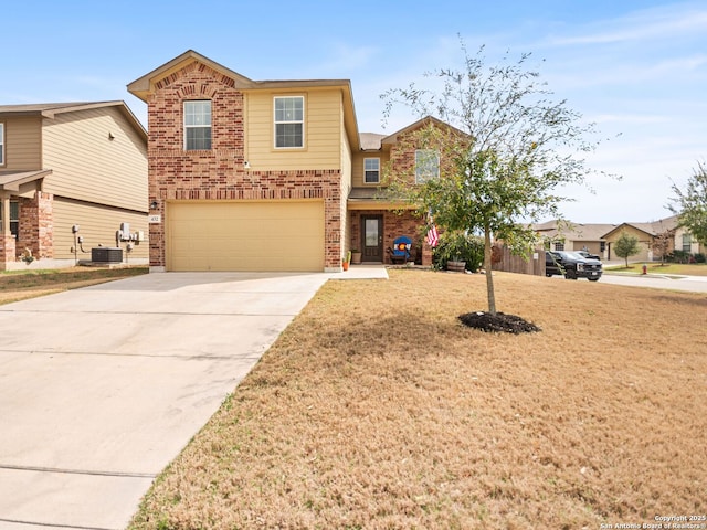 traditional-style house featuring brick siding, concrete driveway, an attached garage, central AC, and a front yard