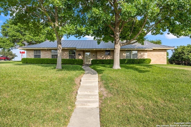 6822 Moss Oak, San Antonio, TX 78229 - view of front of home featuring a standing seam roof and a front yard