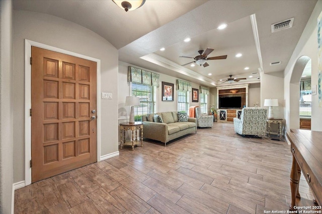 6822 Moss Oak, San Antonio, TX 78229 - living room with wood finished floors, ceiling fan, arched walkways, baseboards, and recessed lighting