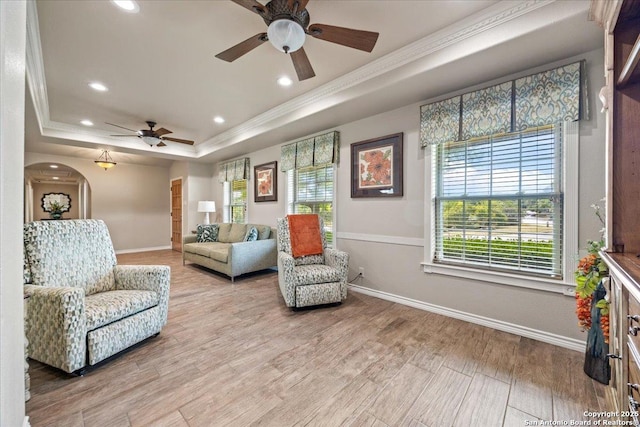 6822 Moss Oak, San Antonio, TX 78229 - living room featuring a tray ceiling, a ceiling fan, baseboards, recessed lighting, and crown molding