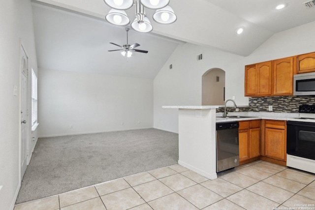 kitchen featuring light carpet, a sink, electric stove, dishwasher, and stainless steel microwave