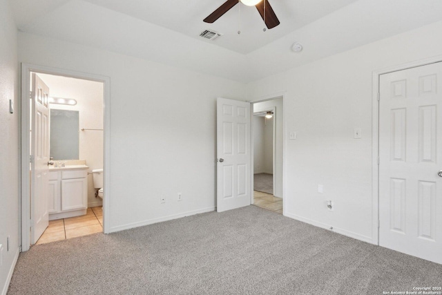 unfurnished bedroom featuring light colored carpet, visible vents, and baseboards