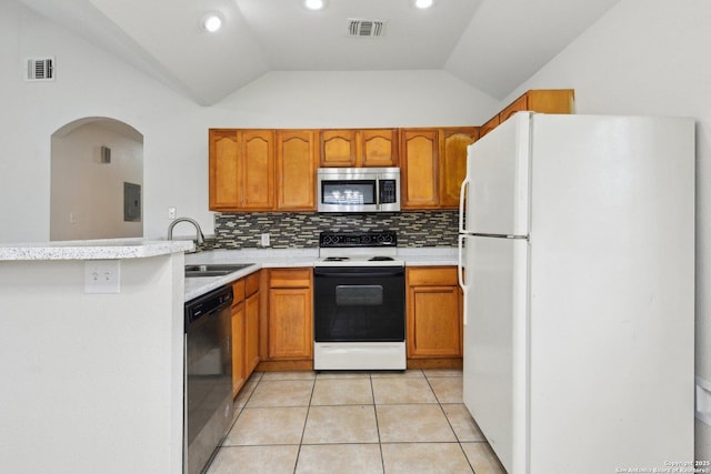 kitchen featuring visible vents, stainless steel microwave, freestanding refrigerator, range with electric cooktop, and dishwasher