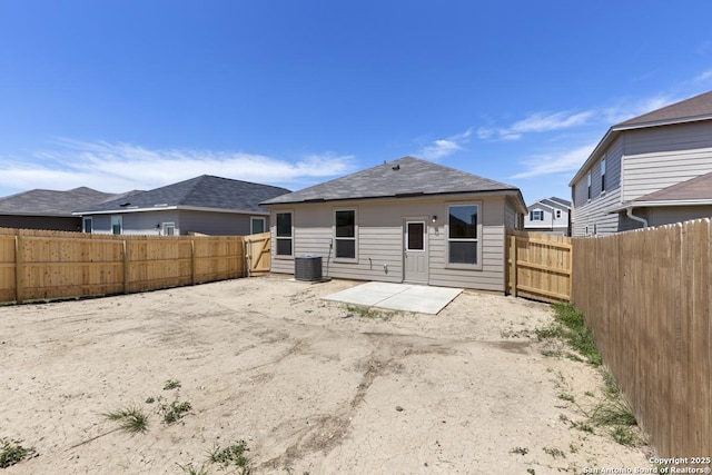 9538 Reinhartz Way, San Antonio, TX 78221 - back of property featuring a patio, central AC unit, and a fenced backyard
