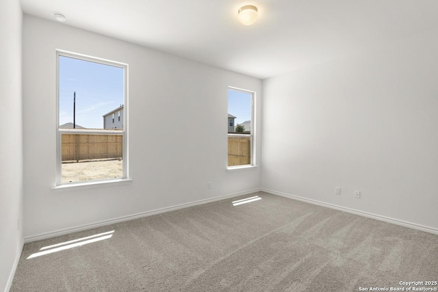 9538 Reinhartz Way, San Antonio, TX 78221 - carpeted spare room with healthy amount of natural light, baseboards, and a smoke detector
