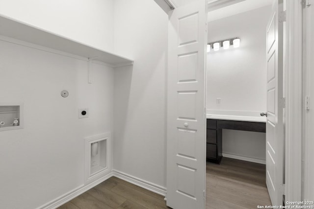 9538 Reinhartz Way, San Antonio, TX 78221 - laundry room with dark wood-style floors, hookup for an electric dryer, washer hookup, baseboards, and gas dryer hookup