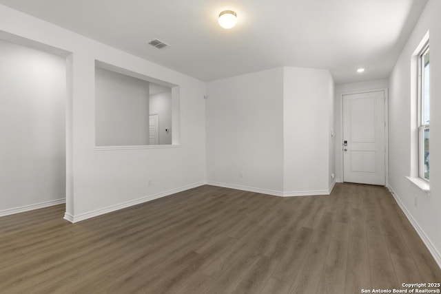 9538 Reinhartz Way, San Antonio, TX 78221 - empty room with wood finished floors, baseboards, and recessed lighting