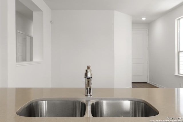 9538 Reinhartz Way, San Antonio, TX 78221 - kitchen view of a sink, light countertops, and recessed lighting