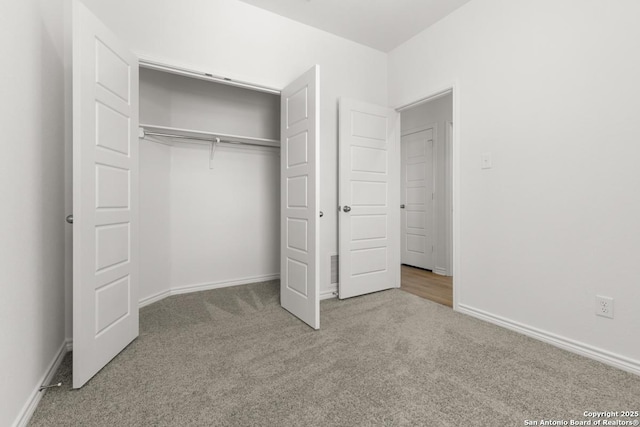 9538 Reinhartz Way, San Antonio, TX 78221 - unfurnished bedroom with carpet floors, a closet, and baseboards