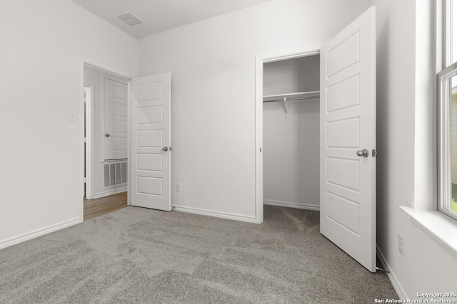 9538 Reinhartz Way, San Antonio, TX 78221 - unfurnished bedroom featuring carpet floors, a closet, and baseboards
