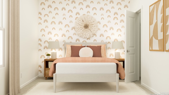 bedroom featuring light carpet, wallpapered walls, an accent wall, and baseboards