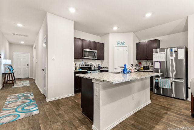 kitchen featuring visible vents, stainless steel appliances, dark wood finished floors, and dark brown cabinetry