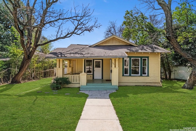 bungalow-style house with a porch and a front yard