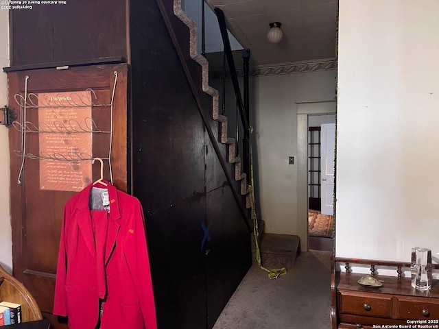 corridor with concrete floors and stairs