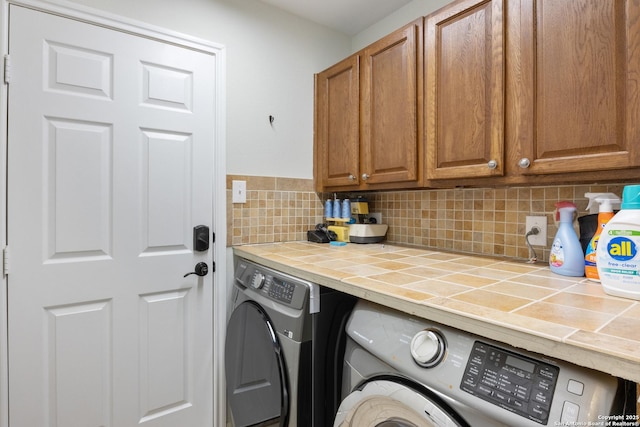 laundry area featuring cabinet space and independent washer and dryer