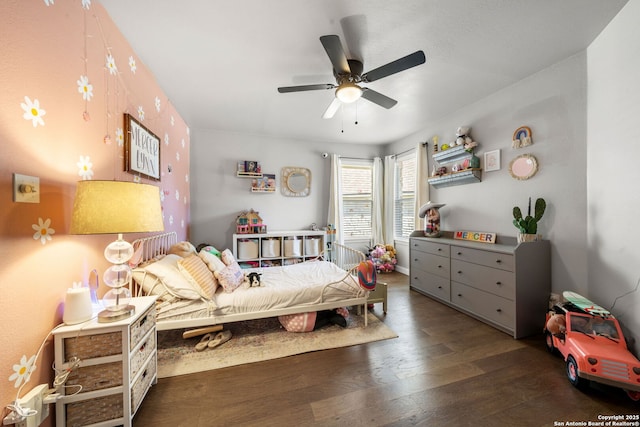 bedroom with ceiling fan and wood finished floors