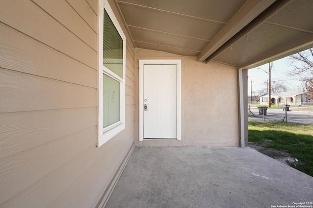 doorway to property with stucco siding