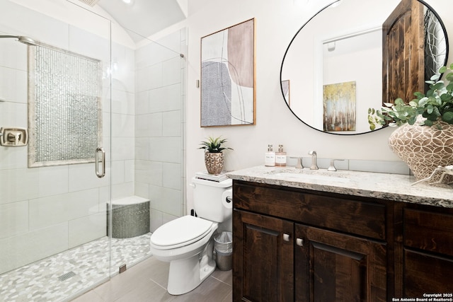 full bath featuring toilet, a stall shower, tile patterned floors, and vanity