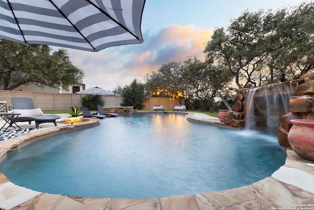 view of swimming pool with a fenced in pool, a patio area, and a fenced backyard