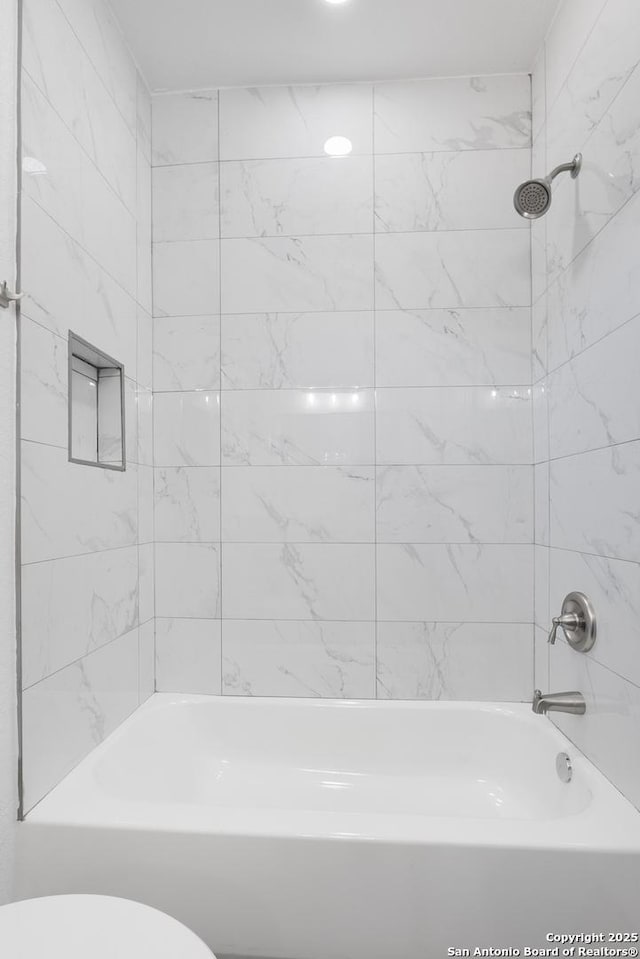 full bathroom with shower / tub combination and toilet