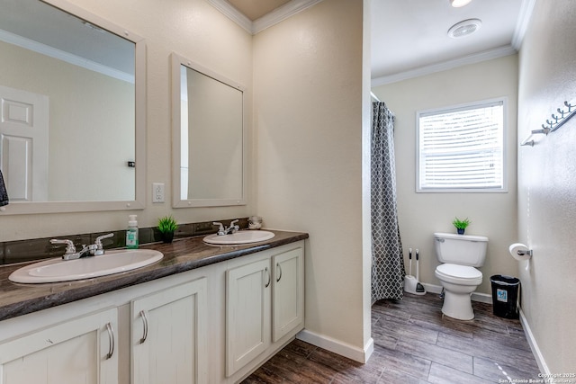 full bathroom with wood finished floors, ornamental molding, a sink, and toilet