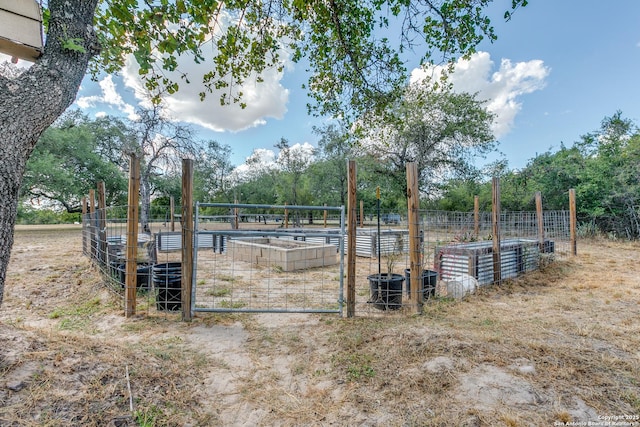 exterior space with a garden and fence