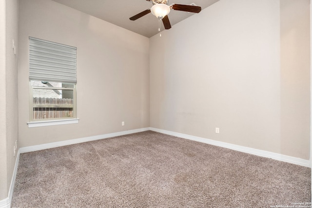 empty room with ceiling fan, carpet flooring, and baseboards